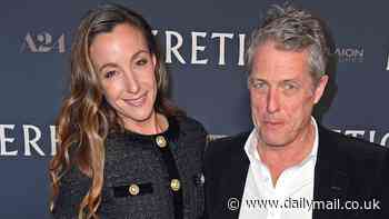 Hugh Grant, 64, looks dapper figure in a velvet blazer as he is joined by stunning wife Anna Eberstein, 41, at the Heretic premiere in Berlin