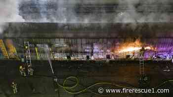 Las Vegas firefighters battle burning vehicles inside railcar