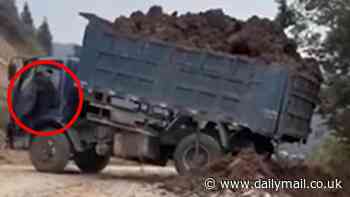 Dramatic moment dump truck driver makes shocking mistake... nearly costing his life