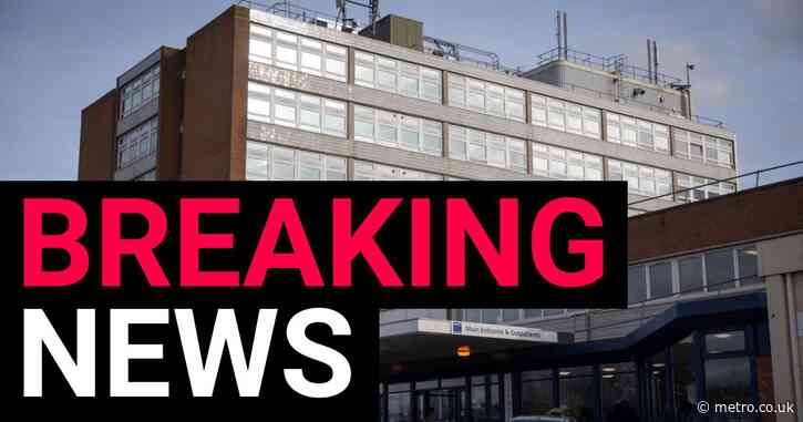 Car crashes into hospital building with people trapped underneath