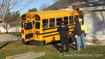 Photos: Wis. school bus crashes into house, trapping resident