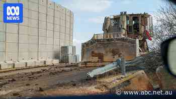 Barbed wire, mud, concrete walls and burnt-out cars — the scars of war along the 'blue line'