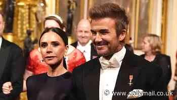 Proud David Beckham gives a reassuring hand to wife Victoria after she appears nervous as they join the royals at King's glittering state banquet for Qatar