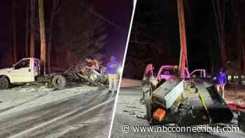 Pickup truck crashes into pole after sliding on black ice in Monroe