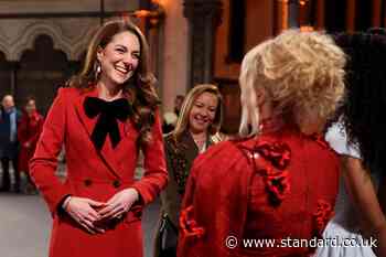 Kate looks festive as she arrives at Christmas carol service after 'brutal' year