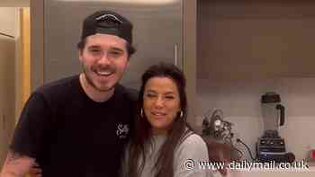 Eva Longoria cuddles up to 'nephew' Brooklyn Beckham as they cook up a storm during collaboration on their Mexican spices and hot sauce ranges before tucking into tostadas