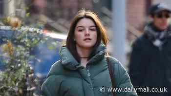 Suri Cruise bundles up in a thick coat as she heads to theater to catch mom Katie Holmes' play in NYC