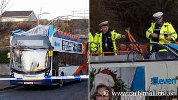 Four people in hospital after double-decker bus hits a railway bridge tearing off its roof