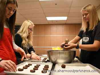 SCA students cook up kindness through community kitchen