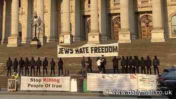 Neo-Nazis unfurl 'Jews hate freedom' banner on steps of Victorian parliament in brazen protest