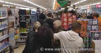 Chocolates handed out to supermarket shoppers who face long queues in Warrington