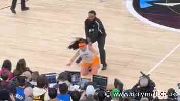 Instagram models tackled to ground by NBA security after storming onto court as star player gets close-up view