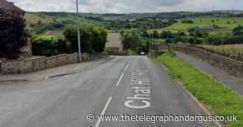 Woman arrested after car ends up on its roof in Bradford