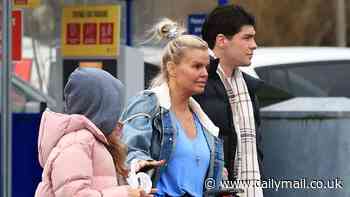 Kerry Katona cuts a casual figure in a plunging blue top and denim jacket as she arrives at Northwich theatre for Cinderella pantomime