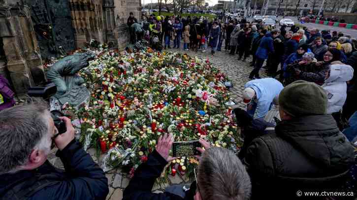 Germans mourn the 5 killed and 200 injured in the apparent attack on a Christmas market