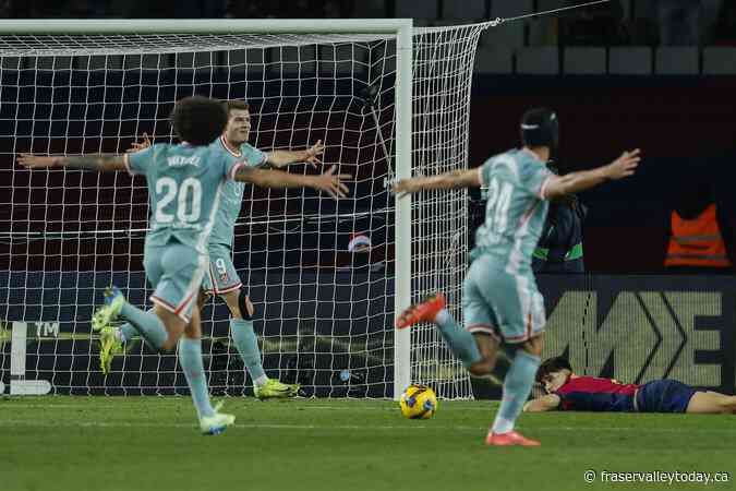 Atletico Madrid stuns Barcelona in stoppage time to snatch La Liga lead