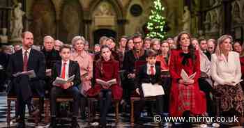 Proud Prince William and Princess Kate pictured beside all three children at Christmas concert