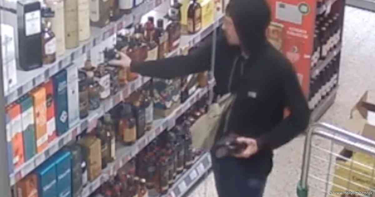 Brazen robber armed with screwdriver caught stuffing booze in bag