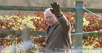 King Charles III pictured smiling and waving as he leaves church service