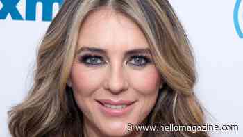 Elizabeth Hurley is a total siren with wet hair and leather mini dress look