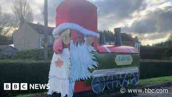 Village that decorates its phone box every Christmas