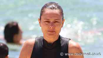 A Current Affair host Allison Langdon flaunts her incredible figure in a swimsuit as she enjoys a dip at Bronte Beach