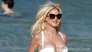 Victoria Silvestedt, 50, puts on a very busty display in a plunging white bikini as she hits the beach in St Barts