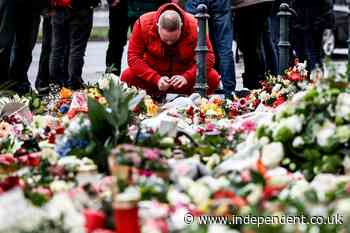 German Christmas market attack latest: Tributes to boy, 9, amid concerns over security and intelligence lapse