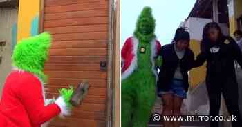 Bizarre moment cop dresses as Grinch to raid family of cocaine dealers