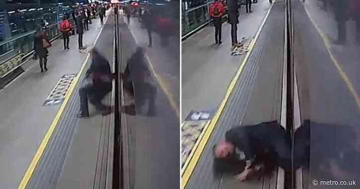 Moment man is nearly dragged under train at London station