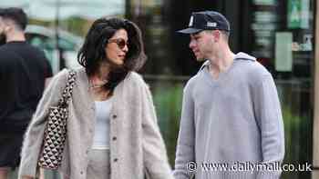 Priyanka Chopra models a cozy cardigan as she Christmas shops with Nick Jonas and daughter Malti