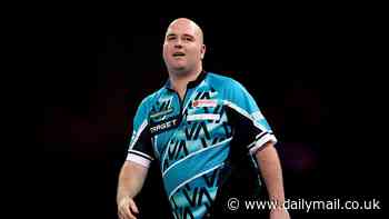 Rob Cross appears to make an obscene gesture midway through his World Darts Championship clash with Scott Williams at Ally Pally - before later going on to lose second-round tie