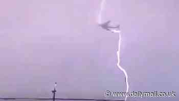 Incredible moment jet is hit by lightning in European storm that also saw passenger plane struck by electrical bolt, forcing it to divert