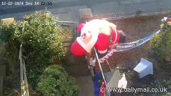 Moment real-life Scrooge 'slashes' inflatable Santa Claus - leaving little girl 'heartbroken'