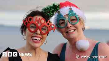 Festive swimmers brave the cold for Christmas Eve dip