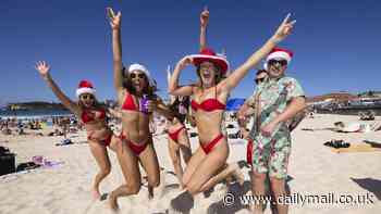 Red hot Christmas: Thousands of bikini-clad revellers embrace the festive season by hitting Bondi Beach