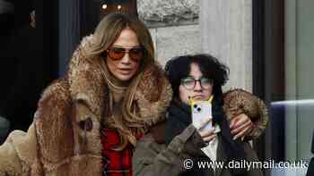 Jennifer Lopez hugs child Emme while bundled up with family on Christmas Eve shopping trip in Aspen