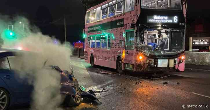 Man and woman in their 30s taken to hospital after car crashes into bus