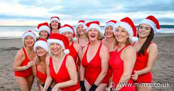 Brave Brits strip off and plunge into icy water for Christmas Day dip at UK beaches