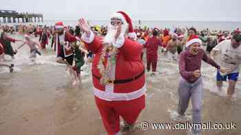 It's a blue Christmas for this lot! Swimmers brave chilly waters to take Christmas Day dips across the country