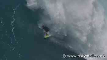 Terrifying moment surfer vanishes into monster wave on notoriously dangerous beach