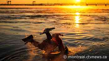 Ho! Ho! HOLY that's cold! Montreal boogie boarder in Santa suit hits St. Lawrence waters