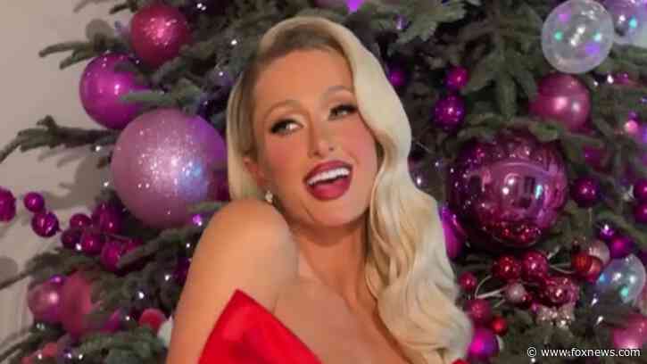 Paris Hilton strips down for racy Christmas photoshoot: ‘My presence is a present’