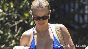 Pregnant Madeline Holtznagel steps out in a blue bikini as she joins Justin Hemmes for lavish Boxing Day yacht party near their $100m mansion