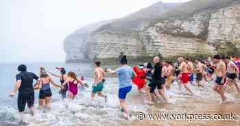 PICTURES: Boxing Day swimmers plunge into North Sea in East Yorkshire village