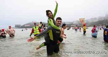 Couple's sweet moment captured on camera at Tenby's Boxing Day swim