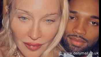 Madonna shares sultry Christmas snap of shirtless toyboy Akeem Morris posing under tree