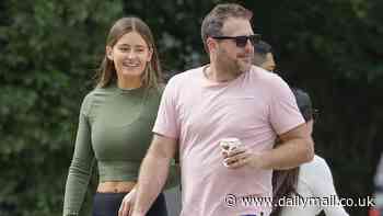 Footy great Campbell Brown steps out with a friend just before he's due to make a bit of Aussie sporting history