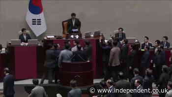 Chanting South Korean ruling party lawmakers swarm parliament in protest of impeachment vote