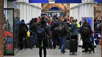 Eurostar passengers get stuck in Channel Tunnel for 2.5 hours as Christmas engineering works and 'a precarious tree' bring chaos to rail lines across UK